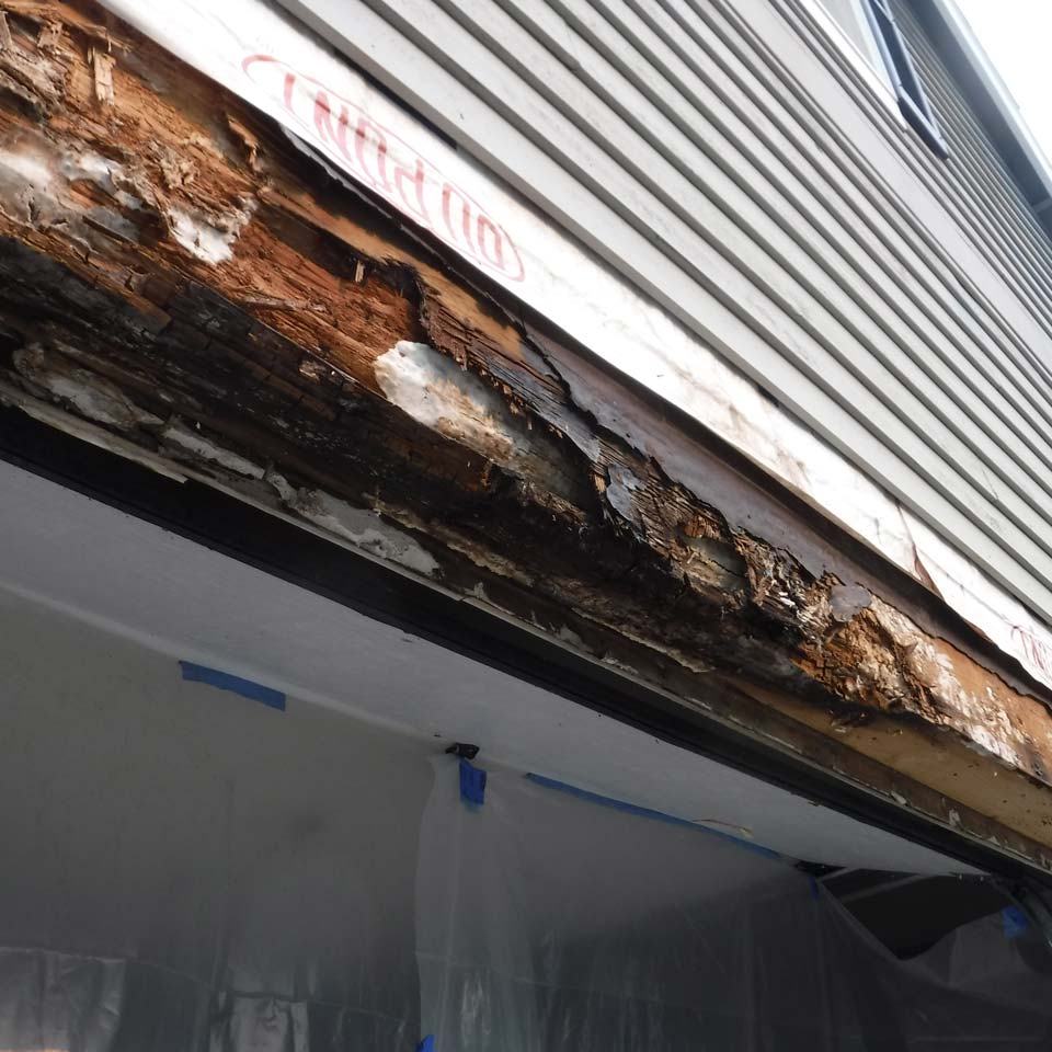 Dry Rot Damage Above Garage